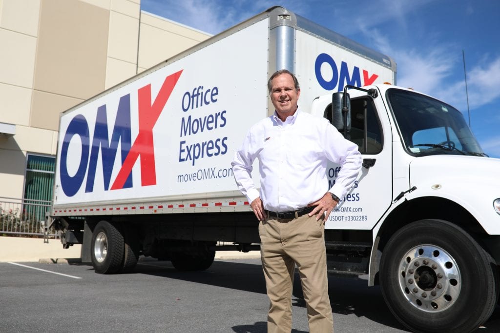 Jim Durfee standing in front of OMX truck